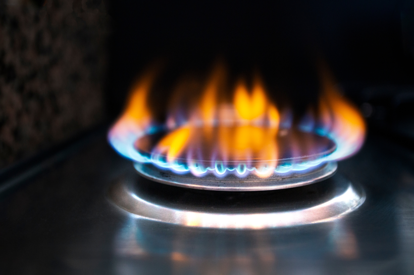 A closeup photo of a natural gas stove flame