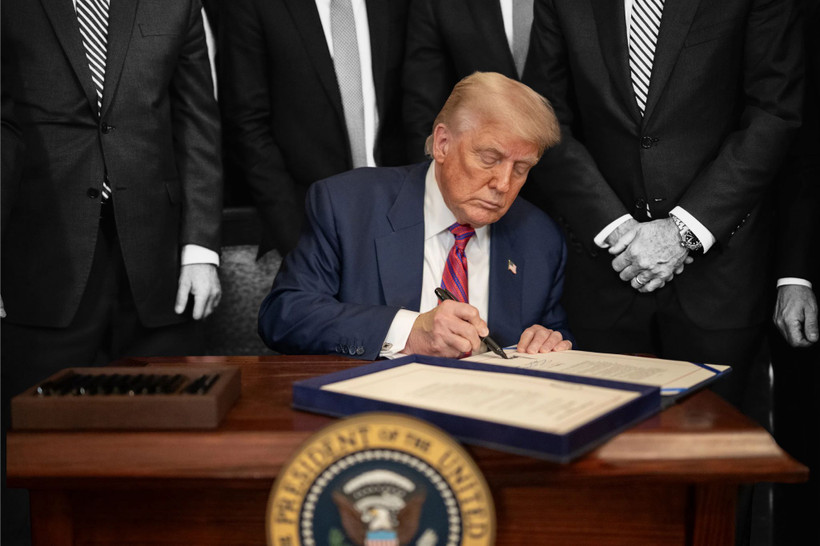 Trump signing an executive order