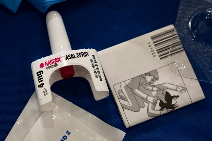 Close up of Narcan nasal spray, showing the part that goes in your nose, along with instructions that come with the medication.