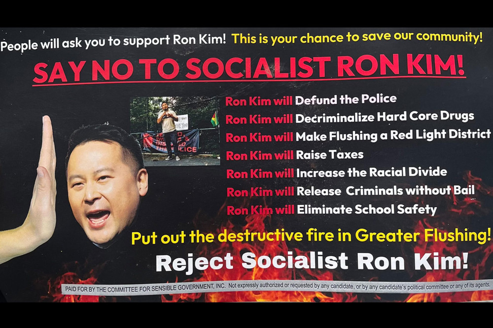 On a black background, a mailer reads SAY NO TO SOCIALIST RON KIM in red letters. A graphic shows Assemblymember Ron Kim's head and a disembodied hand pushing it away.