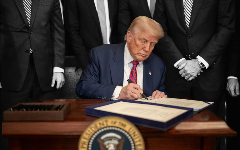 Trump signing an executive order