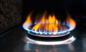 A closeup photo of a natural gas stove flame