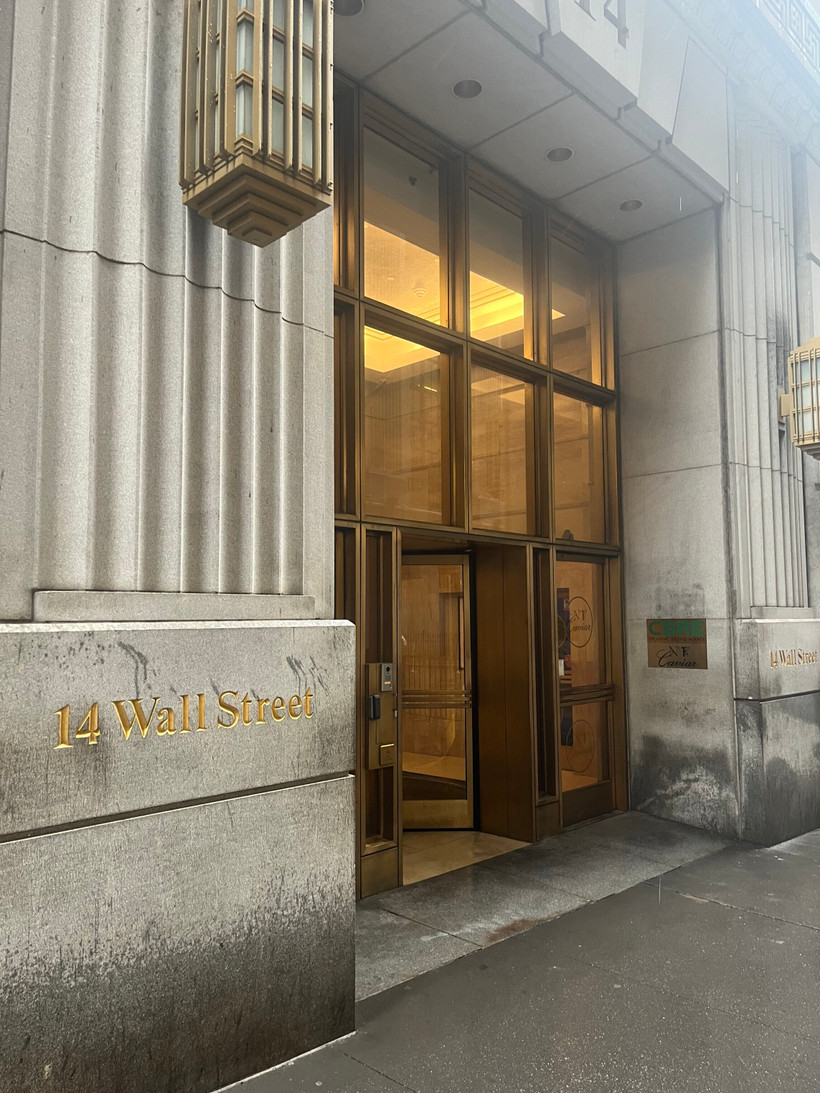 Exterior of an upscale Manhattan office building, address reads "14 Wall Street."