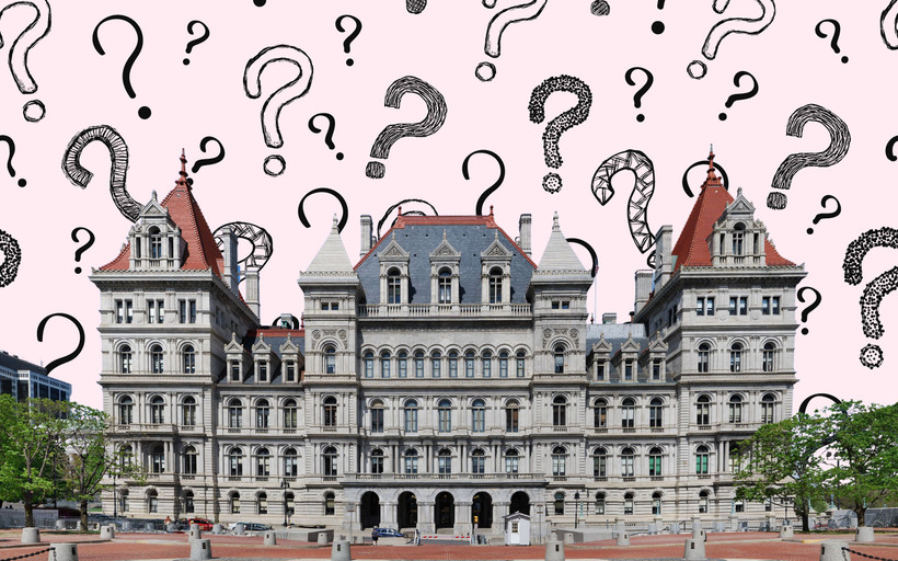 New York State Capitol in front of question marks