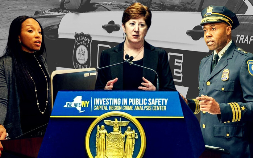 CCRB chair Nairobi Vives, Mayor Kathy Sheehan, and Police Chief Eric Hawkins against a police car