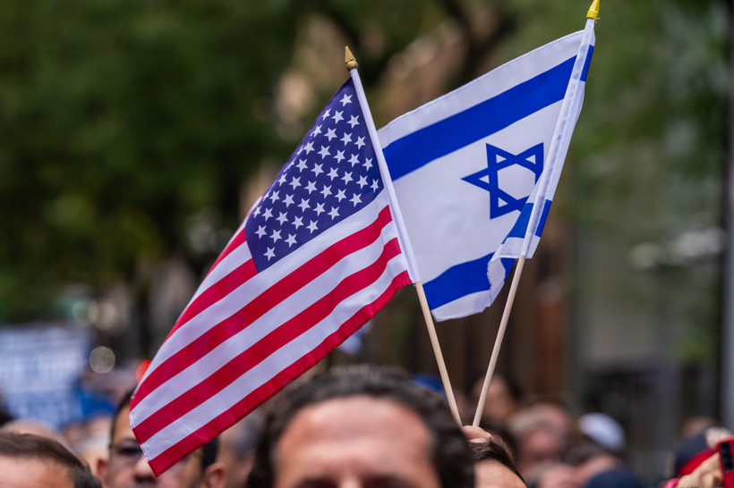 A demonstrator holds an American flag and an Israeli flag at the New York Stands With Israel event on October 10, 2023.
