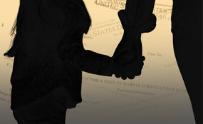 A zoomed-in silhouette of a child and adult holding hands. In the background, paperwork for habeas corpus petitions.