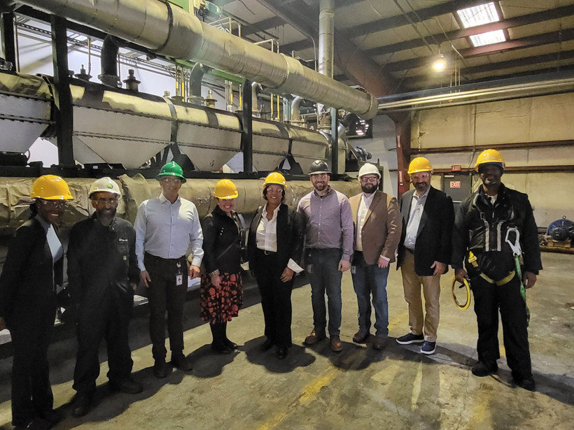 A crowd of people including Assemblymember Alicia Hyndman at a chemical recycling plant in North Carolina